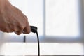 A young man jumping rope. Close-up of his hand and the rope Royalty Free Stock Photo