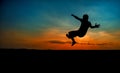 Young man jumping in the sunset Royalty Free Stock Photo