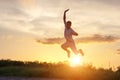 Young man jumping up against the sunset sky Royalty Free Stock Photo