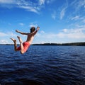 Young man jumping into water