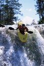 Young man kayaking down waterfall Royalty Free Stock Photo