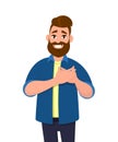 Young man keeping hands on chest. Smiling friendly bearded man expressing gratitude. Royalty Free Stock Photo