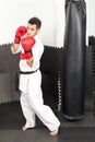 Young man in kimono throwing punches Royalty Free Stock Photo