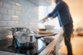 A young man at the kitchen. Kitchen, housework, quarantin, home Royalty Free Stock Photo