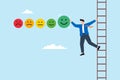 Young man on the ladder giving feedback rating with smile emoticons