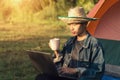 Young man laptop coffee camping tent Royalty Free Stock Photo