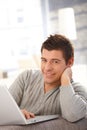 Young man with laptop computer Royalty Free Stock Photo