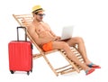 Young man with laptop and suitcase on sun lounger against white background. Royalty Free Stock Photo