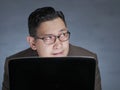 Young Man With Laptop, Thinking Seriously Royalty Free Stock Photo