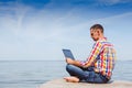 Young man with laptop working outdoor Royalty Free Stock Photo
