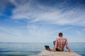 Young man with laptop working outdoor Royalty Free Stock Photo