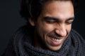 Young man laughing with gray scarf Royalty Free Stock Photo