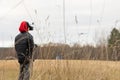 Young man launches rc plane into sky. Teenager with glasses playing with toy radio-controlled airplane outdoors. Boy Royalty Free Stock Photo