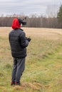 Young man launches rc plane into sky. Teenager with glasses playing with toy radio-controlled airplane outdoors. Boy Royalty Free Stock Photo