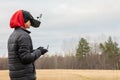 Young man launches rc plane into sky. Teenager with glasses playing with toy radio-controlled airplane outdoors. Boy Royalty Free Stock Photo