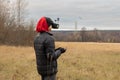 Young man launches rc plane into sky. Teenager with glasses playing with toy radio-controlled airplane outdoors. Boy Royalty Free Stock Photo