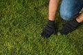 Young man laying grass sod in garden, closeup. Space for text Royalty Free Stock Photo