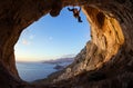 Young man lead climbing on ceiling in cave Royalty Free Stock Photo