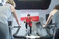 young man leading cycling fitness class Royalty Free Stock Photo