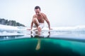 Young man with lean muscular body going to swim Royalty Free Stock Photo