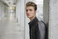 Young man with leather jacket standing outside Royalty Free Stock Photo