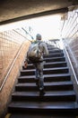 A young man leaves the NYC subway station Royalty Free Stock Photo