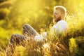 Young man lies and rests in the grass on a meadow Royalty Free Stock Photo