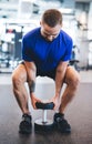 Young man lifting dumbbell at the gym. Royalty Free Stock Photo