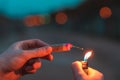 Young Man Lighting Up Firecracker Outdoors Royalty Free Stock Photo