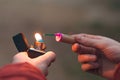 Young Man Lighting Up Firecracker in his Hand Royalty Free Stock Photo