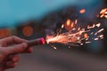 Young Man Lighting Up Firecracker Outdoors Royalty Free Stock Photo