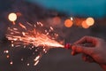 Young Man Lighting Up Firecracker Outdoors Royalty Free Stock Photo