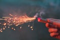 Young Man Lighting Up Firecracker Outdoors Royalty Free Stock Photo