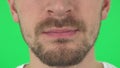 Young man lips with a beard. Close up