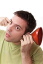 Young man listening through a funnel Royalty Free Stock Photo