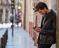 Young man listening music smartphone earphones Royalty Free Stock Photo