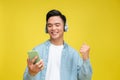 Young man listening music, wearing wireless headphones, enjoying favorite tracks Royalty Free Stock Photo