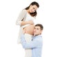 Young Man Listening To His Wife`s Pregnant Belly On A White Background, Woman Pregnancy Royalty Free Stock Photo