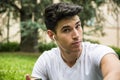 Young Man Listening to Music in Park Royalty Free Stock Photo