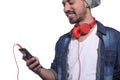 Young man listening to music with smartphone. Royalty Free Stock Photo