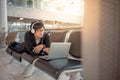 Young man listening to music waiting in airport terminal Royalty Free Stock Photo