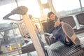 Young man listening to music waiting in airport terminal Royalty Free Stock Photo