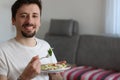 Happy Young Caucasian Man Eating Healthy Salad Royalty Free Stock Photo