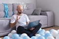 Young man in livingroom using laptop Royalty Free Stock Photo