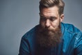 Young man with a long beard deep in thought Royalty Free Stock Photo