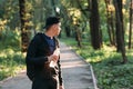 Young man looking back on forest road, free space Royalty Free Stock Photo