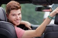 young man looking back while parking new car Royalty Free Stock Photo