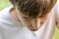 Young man looking down, lost in thought Royalty Free Stock Photo