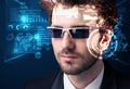 Young man looking with futuristic smart high tech glasses Royalty Free Stock Photo