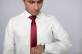 Young man looking at his wrist watch Royalty Free Stock Photo